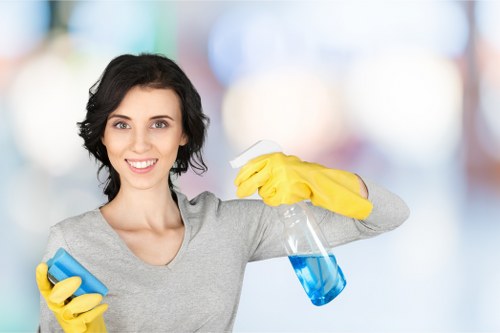 Technician cleaning a couch with specialized equipment